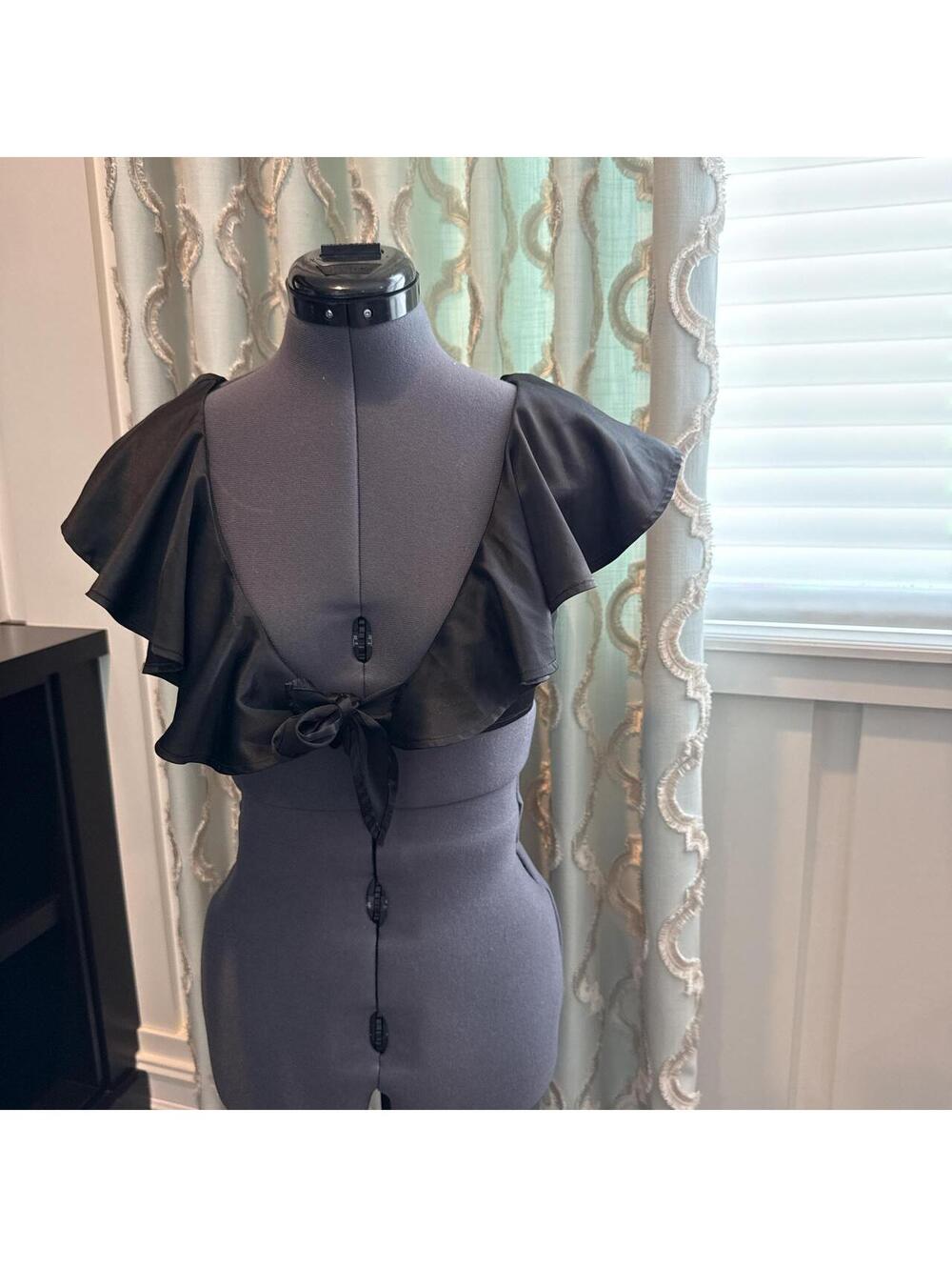 We Wore What black silk/satin cropped top.